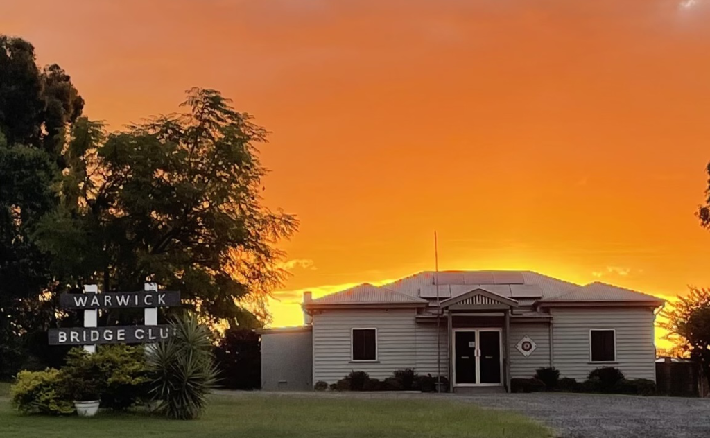 Flaming sunset sky behind Warwick Bridge club